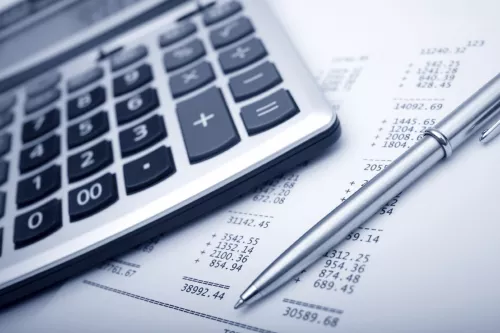 image of calculator pen and paper