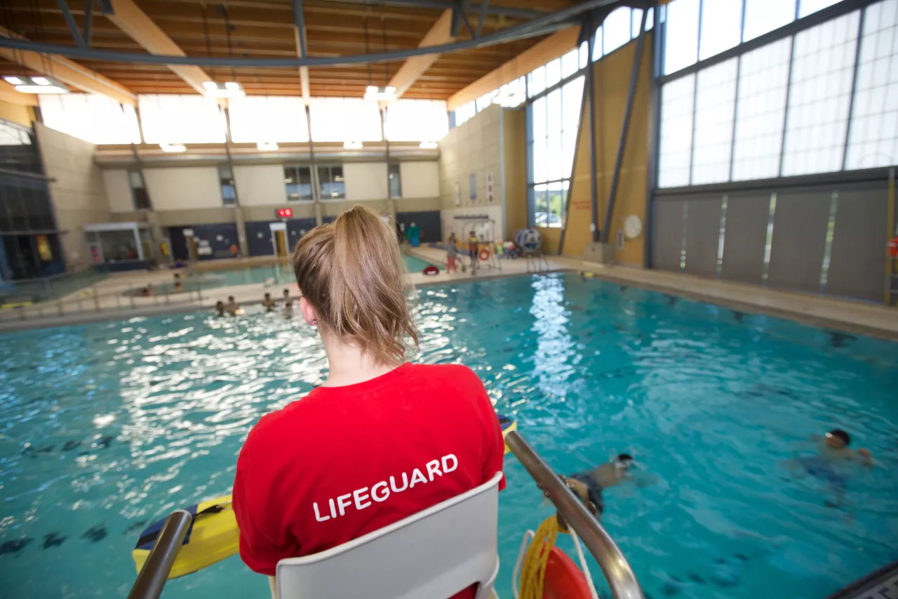 Lifeguard overlooking a swimming pool